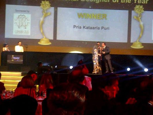 Pria Kataria Puri receives her Award on stage