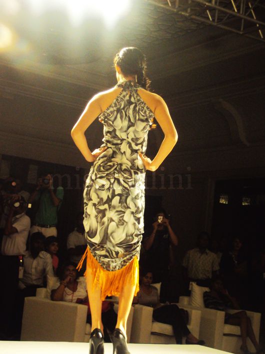 A model wears a fringed Dhara Thakkar creation