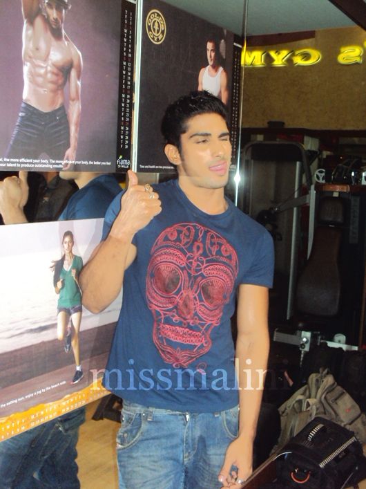 Prateik poses in front of his calendar page