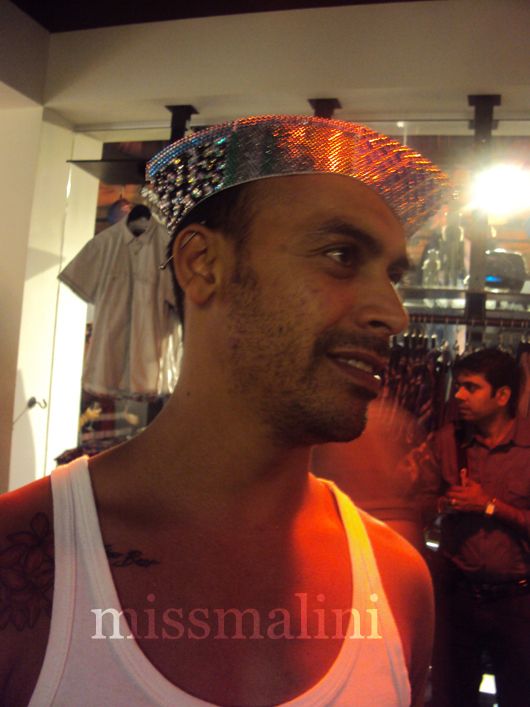 Brandon wears a lovely crystalized Nehru topi 
