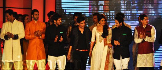 Manish Malhotra flanked by models and Bollywood stars