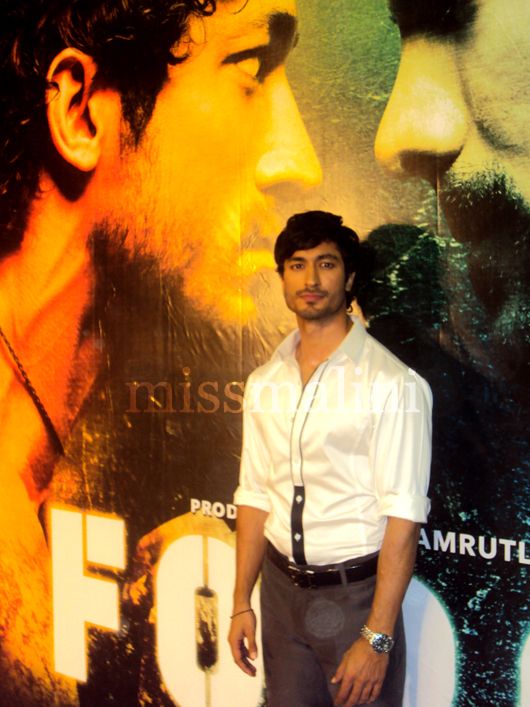 Vidyut strikes a pose against the film poster