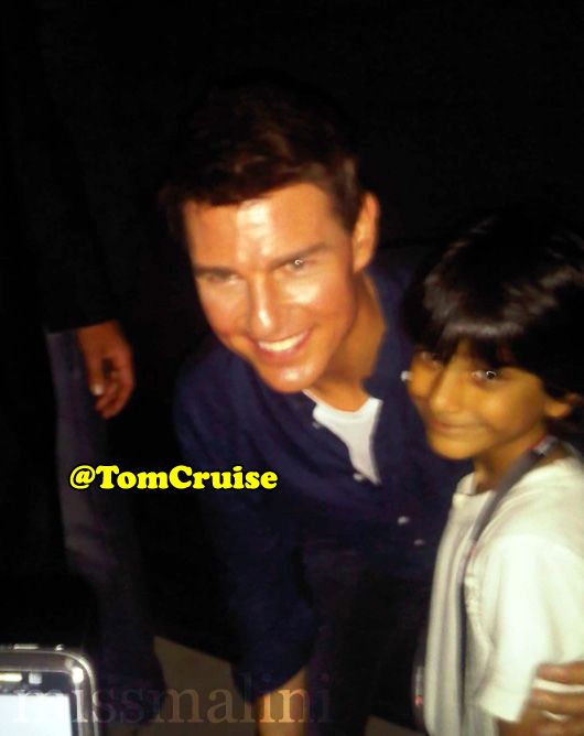 Tom Cruise poses with kids