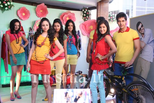Models wear vibrant designs from the Globus Spring Summer 2012 collection