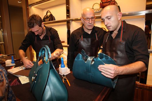 The artisans working on the Stirrup bag
