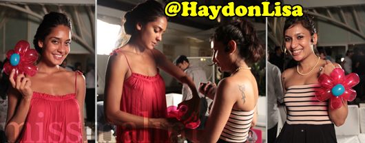 Actress and model, Lisa Haydon, makes balloon animals, headgear and flowers for the guests to wear