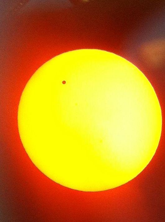 Venus in transit between the sun and the earth