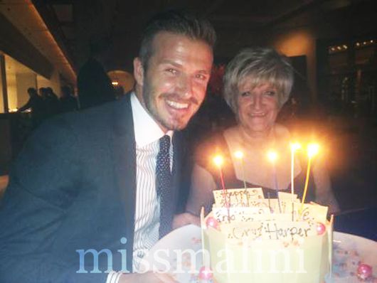 David Beckham with his  mother and his birthday cake