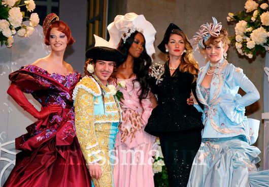 John Galliano takes a bow at a Dior show