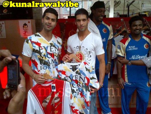 Kunal Rawal and Siddhartha Mallya display the RCB merchandise