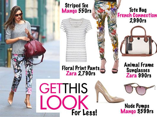 Miranda Kerr in Celine floral pants with Sofia Coppola bag