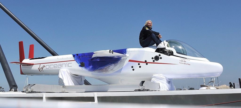 Richard Branson posing on his underwater plane