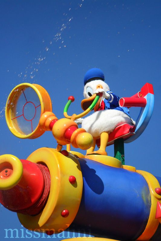 Donald Duck sits atop a float at the Disney parade