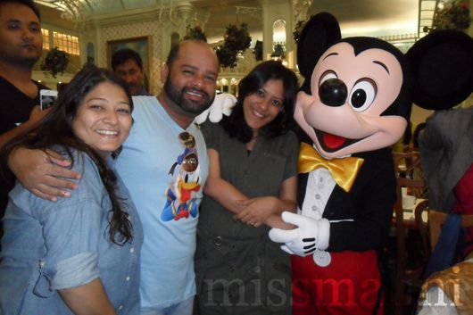 Pooja and Aishwarya from Disney with Ranjit and Mickey Mouse
