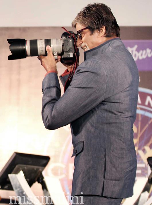Amitabh uses a press photographers camera to take pix of the media