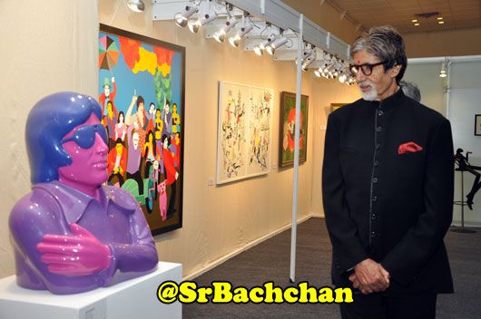 Amitabh Bachchan looks at a fibreglass work of him