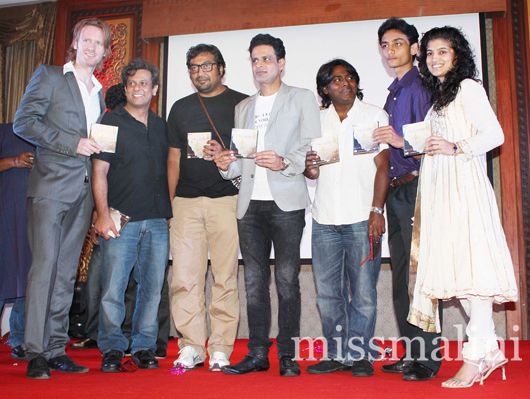 The cast and crew unveil a CD of the film's music