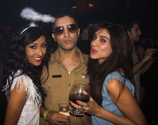 Ishq Bector dressed as a cop and on his right is model Archana Vadnerkar and left, a friend