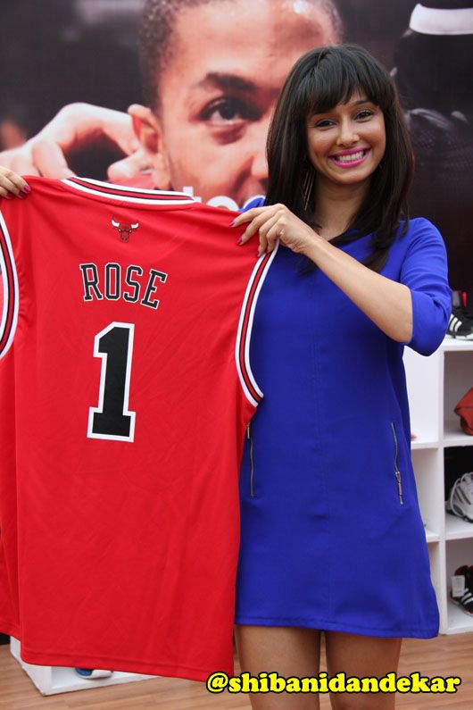 Shibani Dandekar poses with NBA merchandise
