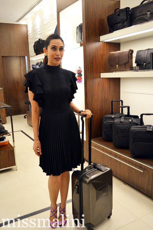 Karishma Kapoor with a Tumi stroller bag