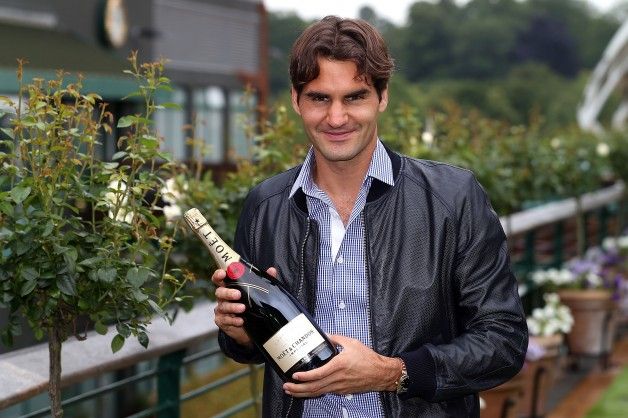 Roger Federer with a Moët & Chandon bottle