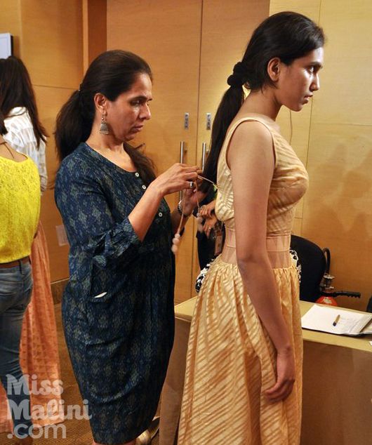 Anita Dongre fits a model | Photo Courtesy: Viral Bhayani