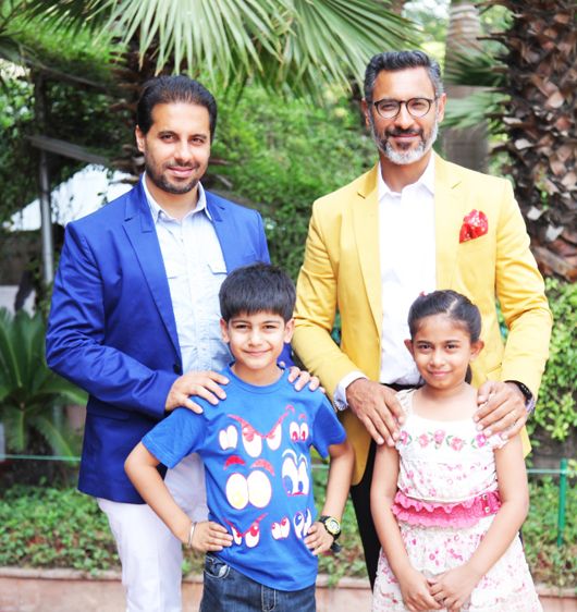 Shantanu & Nikhil with two young winners