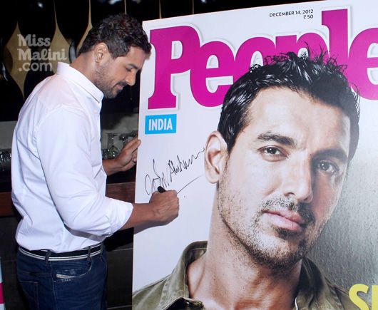 Sexiest Man Alive 2012 John Abraham next to the latest cover of People Magazine