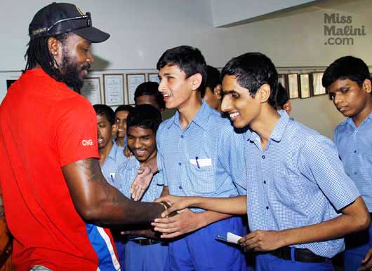Chris Henry Gayle with visually impaired students