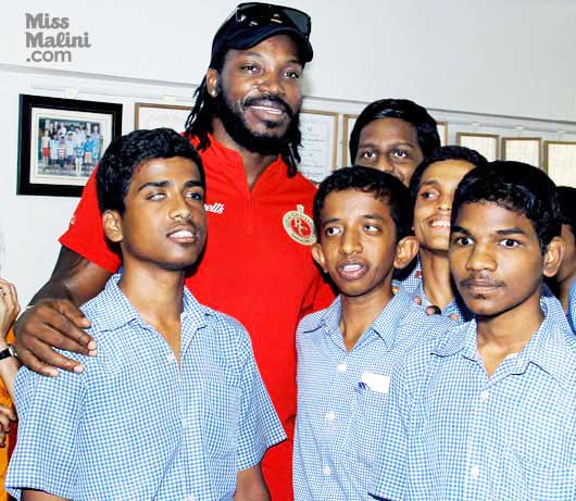 Chris Henry Gayle with visually impaired students