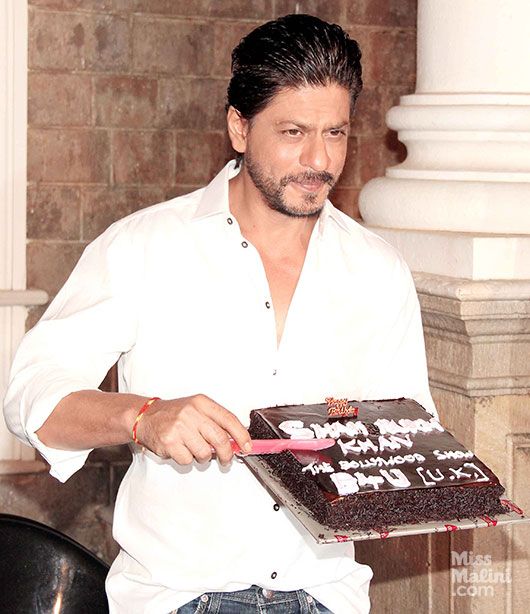 Shah Rukh Khan cutting his birthday cake