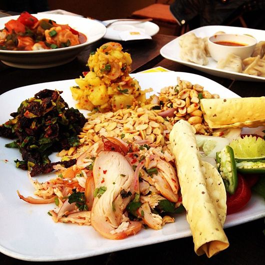 dry buffalo meat and chicken salad with peanuts & grains at Roadhouse Cafe Boudha