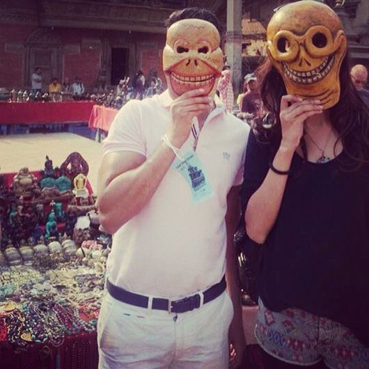 Trying on masks at the local market in Kathmandu, NEpal