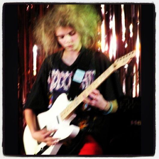 Cara playing the guitar