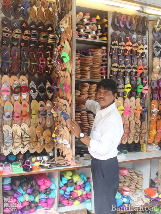 A vendor selling footwear in one of the by lanes of Colaba Causeway.