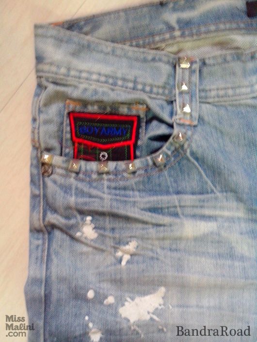 A patch and studs embellish the pockets