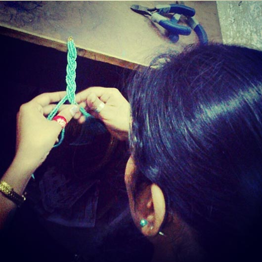 A survivor working on the Choti Necklace