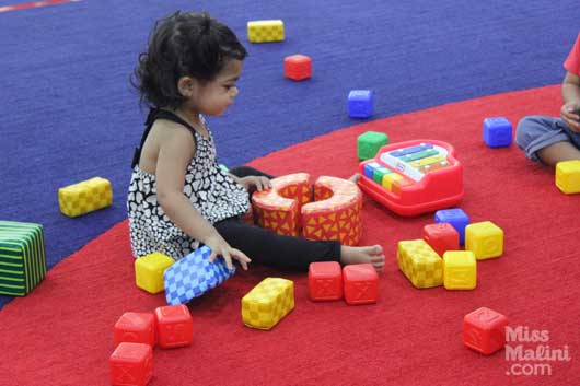 Veda playing with blocks