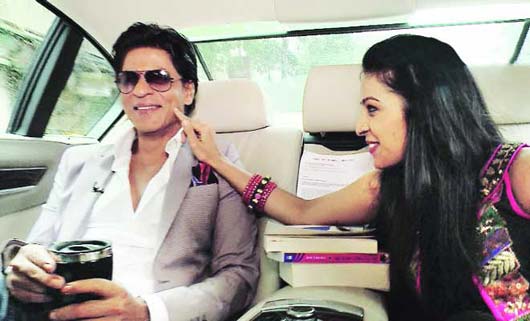 Touching Shah Rukh Khan's dimples!
