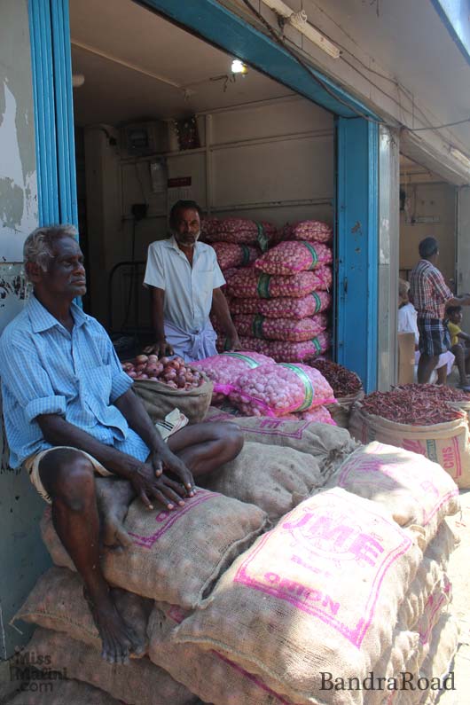 Local Sri Lankans selling their spices and produce outside their warehouses on Fourth Cross Street