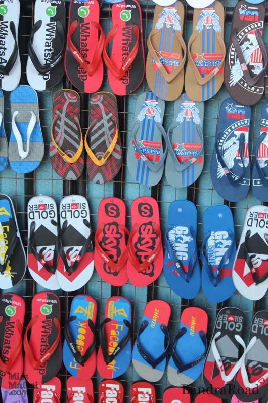 A crazy variety of colorful flip-flops, including Facebook, Whatsapp, Skype and other knock off, branded slippers.  Social media has truly made it to pop culture!