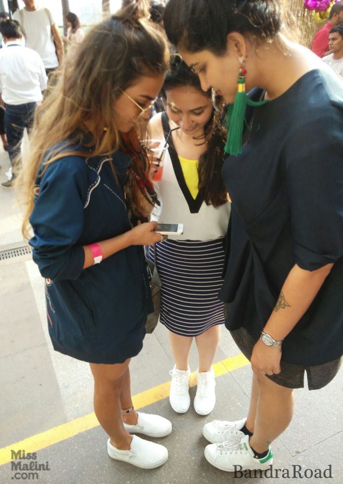 Chandni Sareen, MissMalini's Natasha Patel and Ikai's Ragini Ahuja taking a picture of their white sneakers!