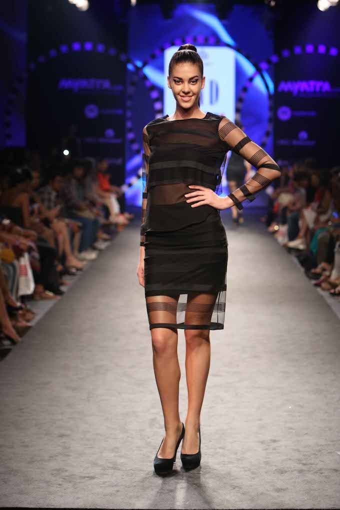 Free Photos - A Female Model Wearing A Unique, See-through Dress As She  Walks Down A Runway Or Poses For The Cameras. She Appears Confident And  Poised, Capturing The Attention Of The