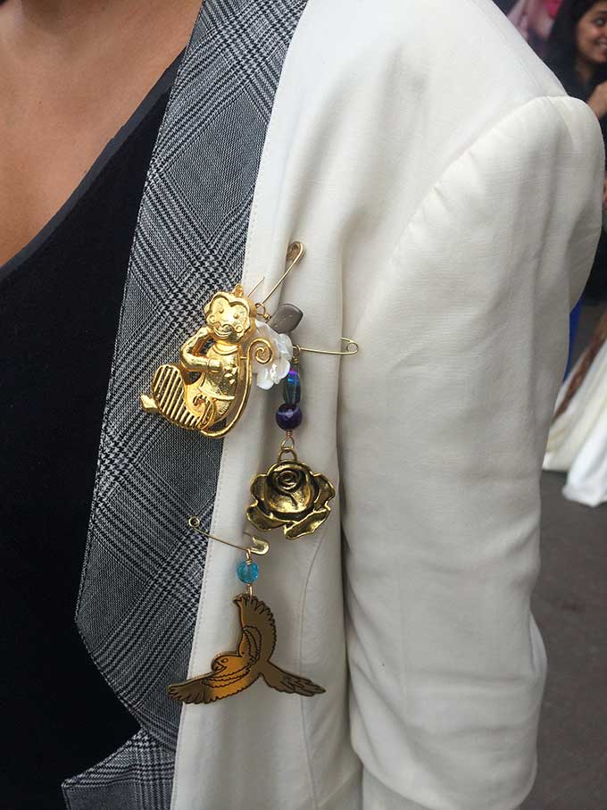 Quirky brooches spotted on a cool blazer at LFW