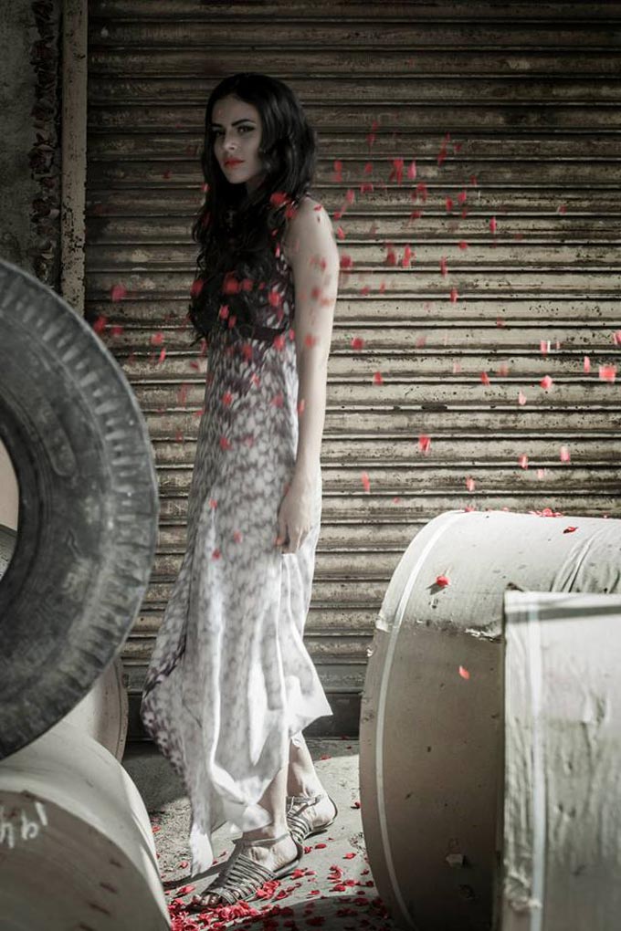 Petals on the dress complimented by the real petals floating in the frame. Shot by Shahid Datawala