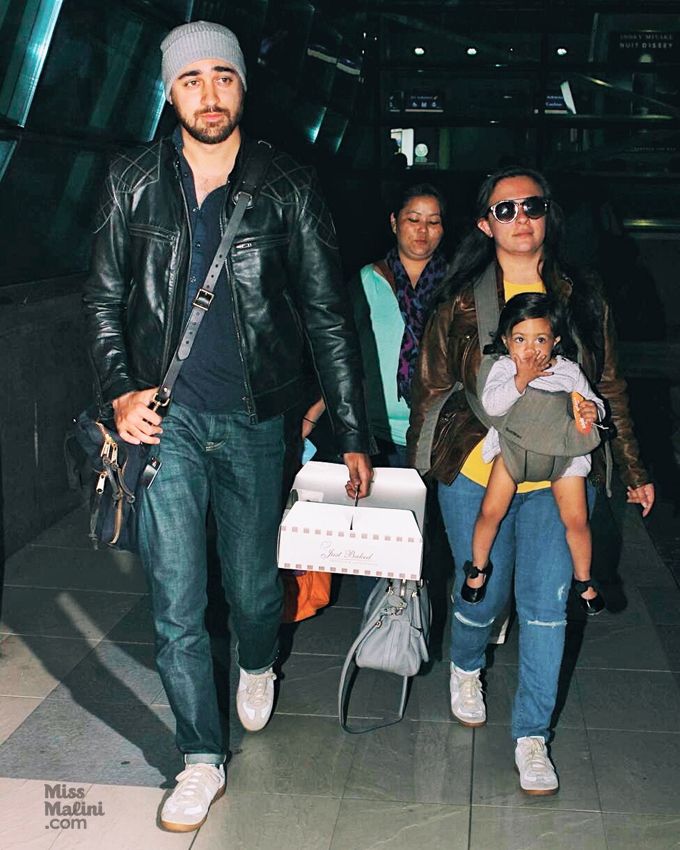 Imran Khan in Belstaff Stannard jacket and Maison Margiela Replica sneakers with wife Avantika and daughter Imara at the Mumbai airport (Photo courtesy | Viral Bhayani)