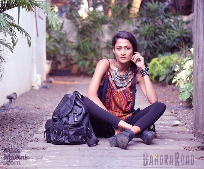 Woman Sitting near Road and Posing · Free Stock Photo