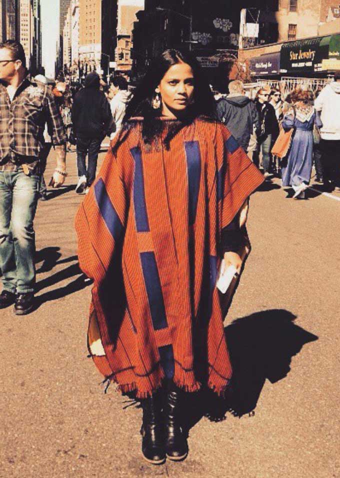 Braving the cold in a dramatic poncho by Nor Black Nor White. (source: @priyankabose20 on Instagram)