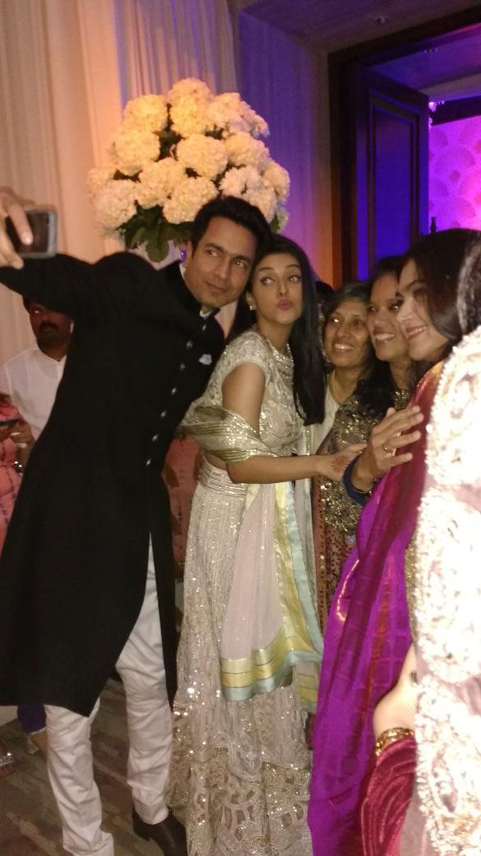 Aww! Asin & Rahul Sharma Can’t Stop Taking Selfies At Their Wedding Reception!