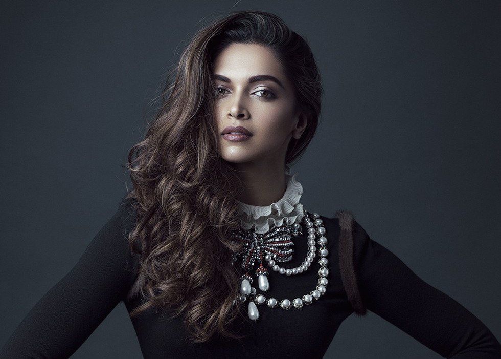In An Exaggerated Mini Dress, High Boots And Dark Lips, Deepika